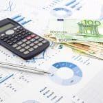 euro currency on graphs, financial planning and expense report b
